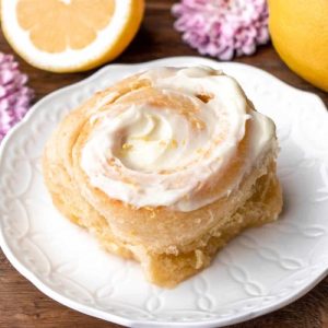 Soft and sticky lemon rollers with cream cheese icing with lemon